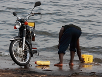 washing bike Bugala Island, Bukoba, East Africa, Uganda, Tanzania, Africa