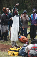 dancing man dress as woman Kilimanjaro, East Africa, Tanzania, Africa