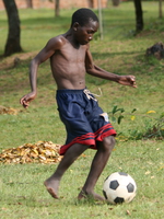 holding the ball Bugala Island, East Africa, Uganda, Africa