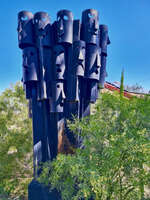Metal sculpture with abstract faces 