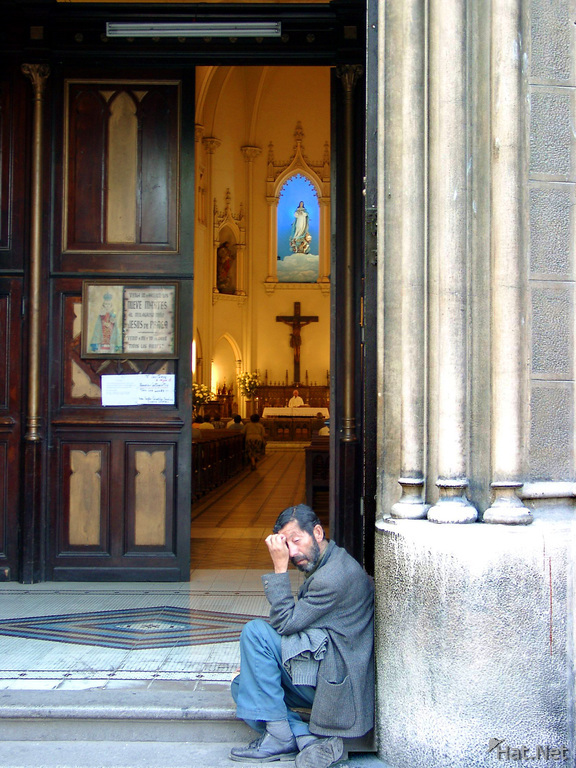 beggar ouside the church
